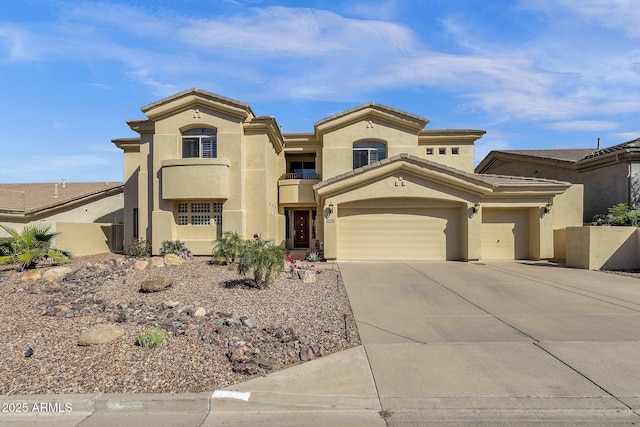 13827 N Mesquite Ln, Fountain Hills, AZ 85268 - mediterranean / spanish-style home featuring concrete driveway, stucco siding, and a garage