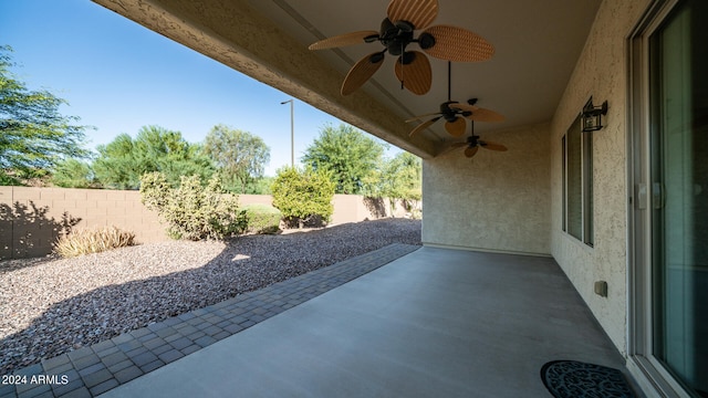 view of patio featuring ceiling fan