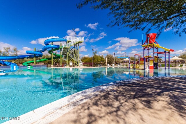 view of swimming pool featuring a water slide