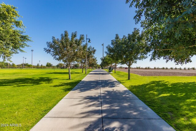 view of home's community featuring a lawn