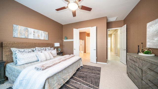 bedroom featuring light carpet and ceiling fan