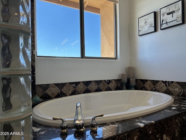 bathroom featuring a garden tub