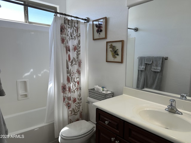 full bath featuring toilet, vanity, and shower / bathtub combination with curtain