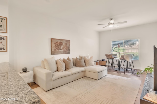 5450 E Deer Valley Dr Unit 1004, Phoenix, AZ 85054 - living area with ceiling fan and wood finished floors