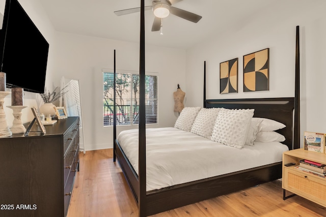 5450 E Deer Valley Dr Unit 1004, Phoenix, AZ 85054 - bedroom with light wood-style floors and ceiling fan