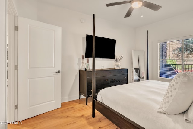 5450 E Deer Valley Dr Unit 1004, Phoenix, AZ 85054 - bedroom featuring light wood-style floors, a ceiling fan, access to outside, and baseboards