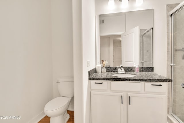 5450 E Deer Valley Dr Unit 1004, Phoenix, AZ 85054 - full bathroom featuring vanity, toilet, a stall shower, and wood finished floors