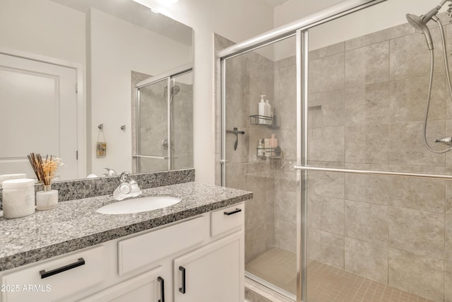 5450 E Deer Valley Dr Unit 1004, Phoenix, AZ 85054 - bathroom with vanity and a shower stall