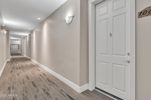 5450 E Deer Valley Dr Unit 1004, Phoenix, AZ 85054 - corridor featuring wood finished floors, baseboards, and recessed lighting