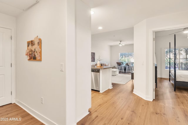 5450 E Deer Valley Dr Unit 1004, Phoenix, AZ 85054 - corridor featuring light wood-type flooring, recessed lighting, and baseboards