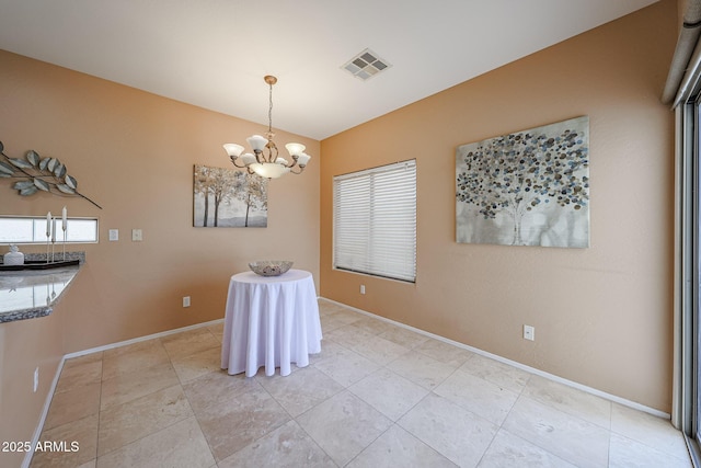 dining space featuring a healthy amount of sunlight, baseboards, a chandelier, and visible vents