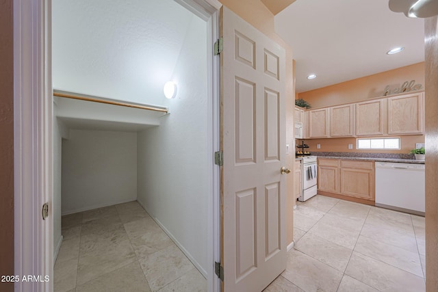 kitchen with recessed lighting, light brown cabinetry, light tile patterned flooring, and white appliances