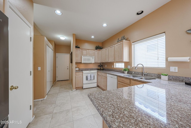 kitchen featuring light brown cabinetry, a sink, light tile patterned flooring, recessed lighting, and white appliances