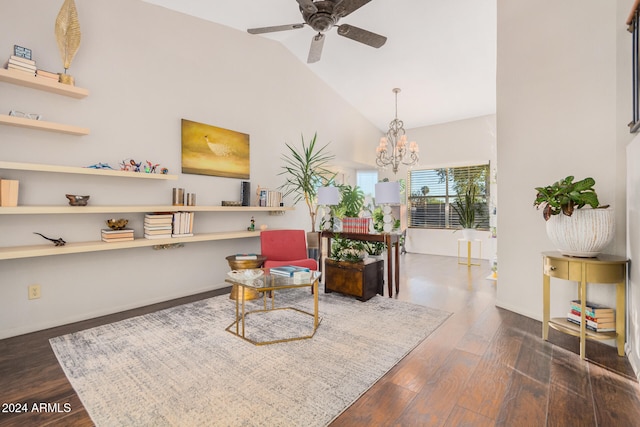 sitting room featuring vaulted ceiling, dark hardwood / wood-style floors, and ceiling fan with notable chandelier