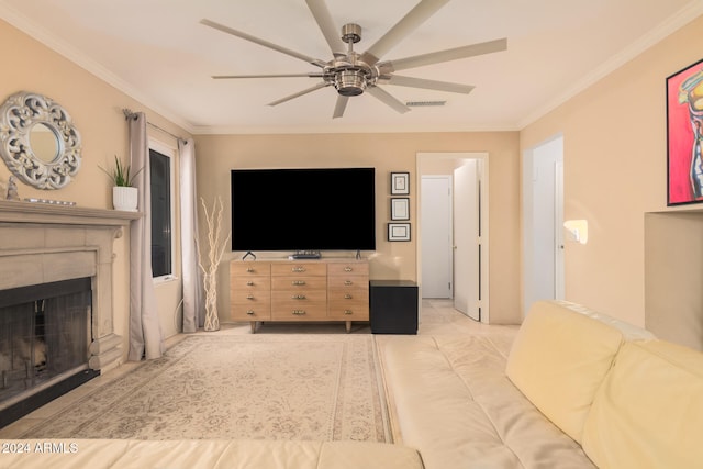 living room with crown molding, a tiled fireplace, and ceiling fan