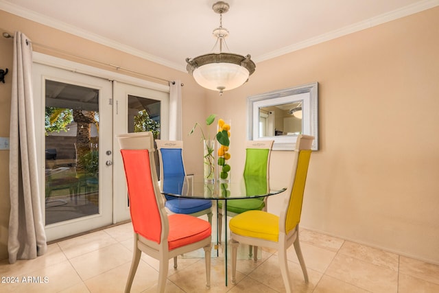 tiled dining room featuring ornamental molding