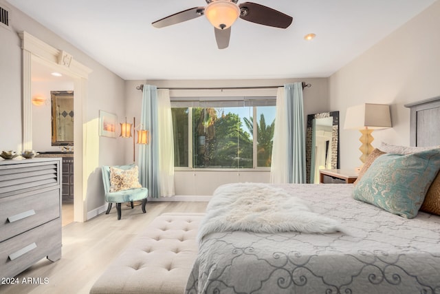 bedroom with light hardwood / wood-style floors and ceiling fan