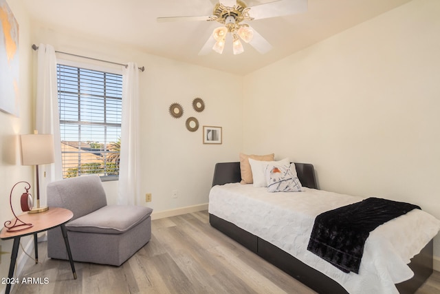 bedroom featuring light wood-type flooring and ceiling fan