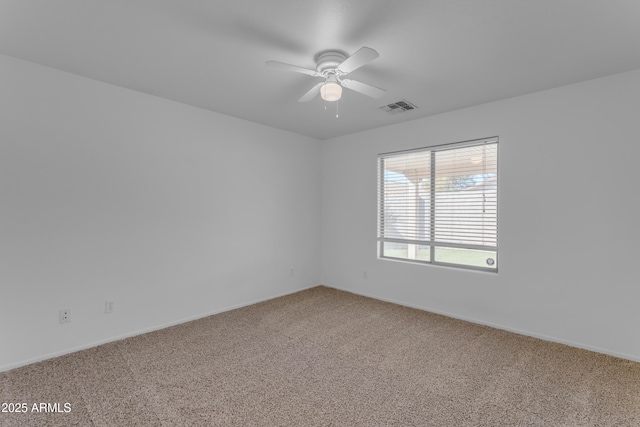 spare room featuring carpet floors and ceiling fan