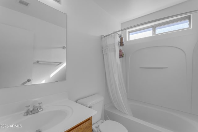 full bathroom featuring shower / tub combo with curtain, vanity, and toilet