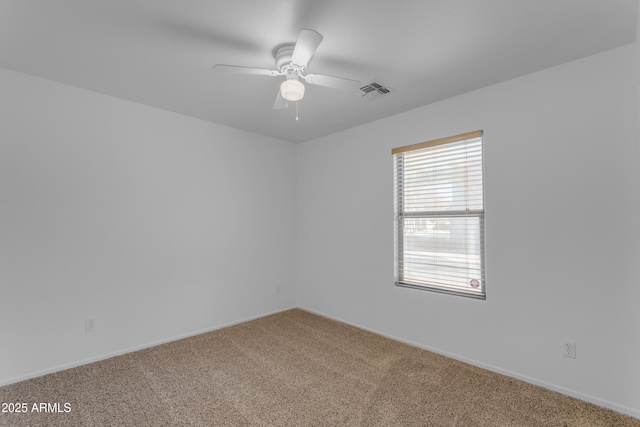 empty room with carpet and ceiling fan