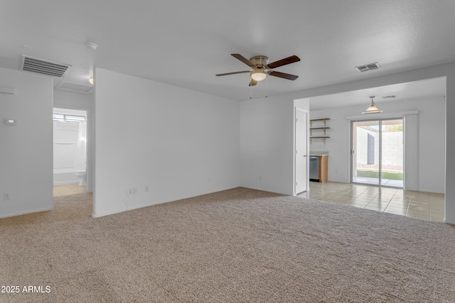 carpeted spare room with ceiling fan