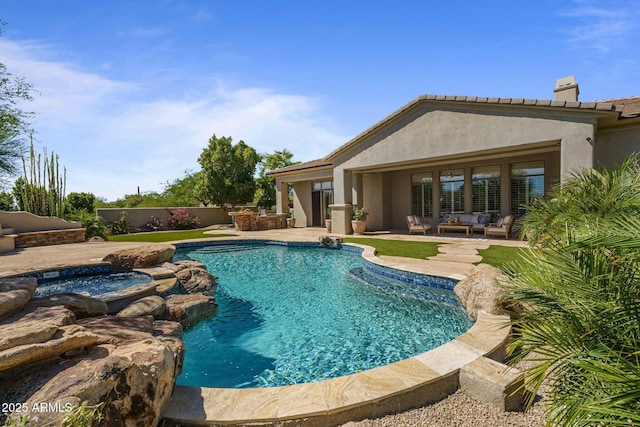 view of swimming pool with a patio area, an outdoor hangout area, and a pool with connected hot tub