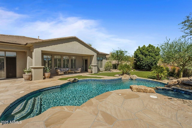 outdoor pool featuring a patio area, an in-ground hot tub, and outdoor lounge area