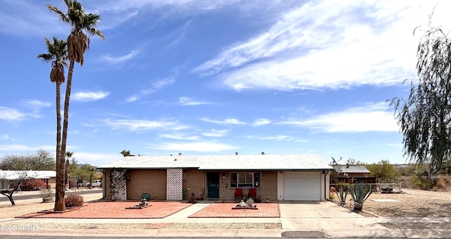 361 W Placer St, Ajo, AZ 85321 - ranch-style house with brick siding, driveway, and a garage