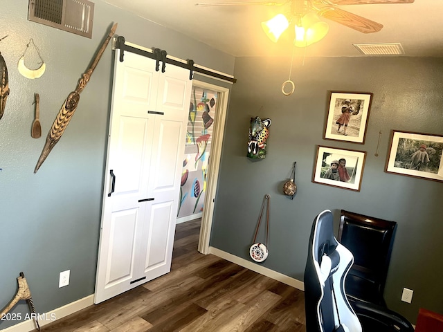 361 W Placer St, Ajo, AZ 85321 - home office with dark wood-type flooring, a barn door, visible vents, and ceiling fan
