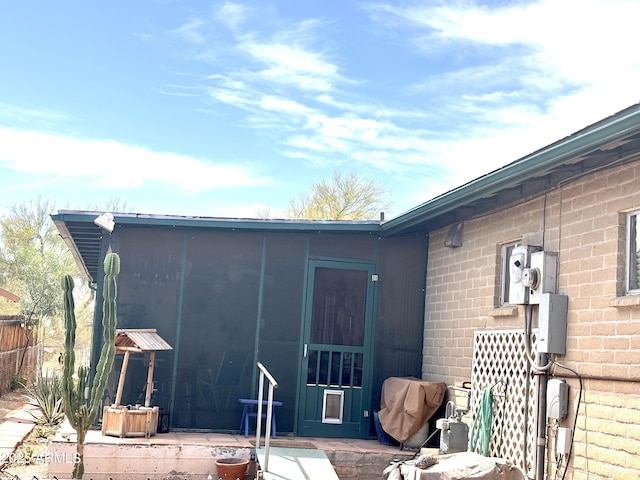 361 W Placer St, Ajo, AZ 85321 - back of house with brick siding and a sunroom
