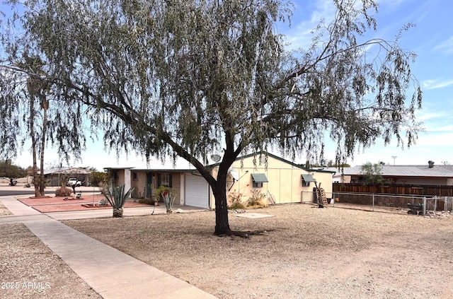 361 W Placer St, Ajo, AZ 85321 - view of property exterior featuring a garage and fence