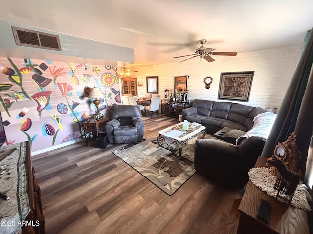 361 W Placer St, Ajo, AZ 85321 - living room with brick wall, visible vents, a ceiling fan, and wood finished floors