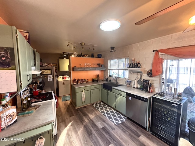 361 W Placer St, Ajo, AZ 85321 - kitchen featuring light countertops, stainless steel dishwasher, a sink, and green cabinetry