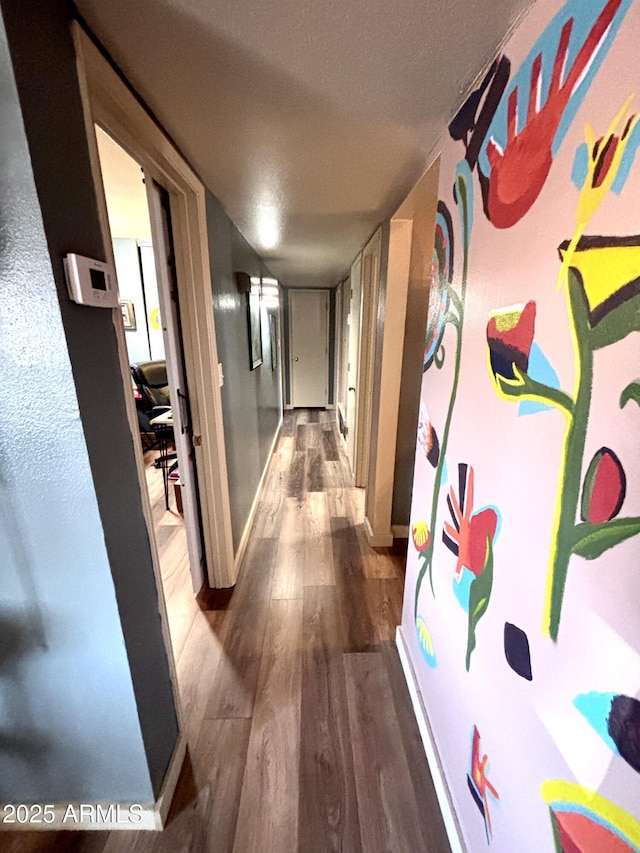361 W Placer St, Ajo, AZ 85321 - hallway with dark wood-style flooring and baseboards