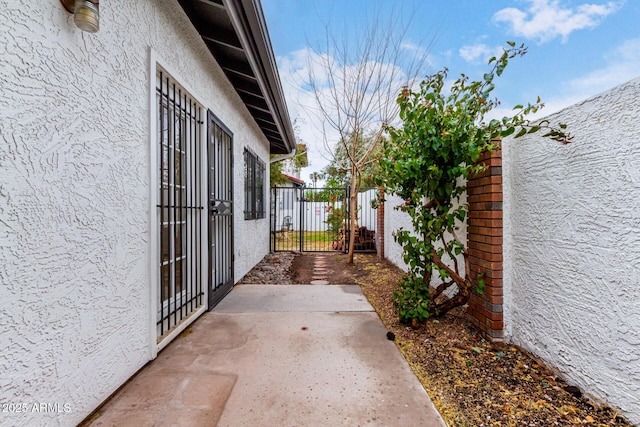 view of patio / terrace featuring fence