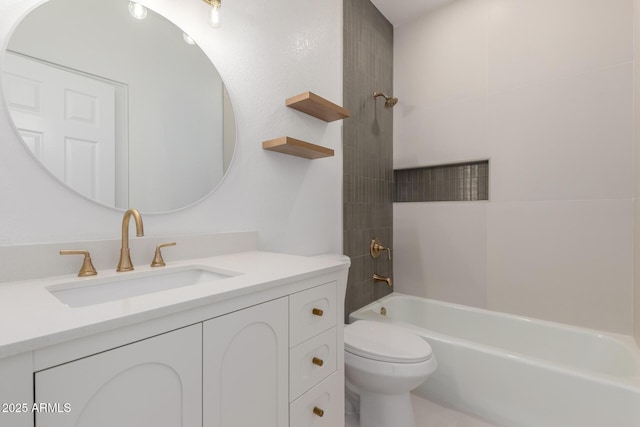 bathroom with toilet, vanity, and shower / tub combination