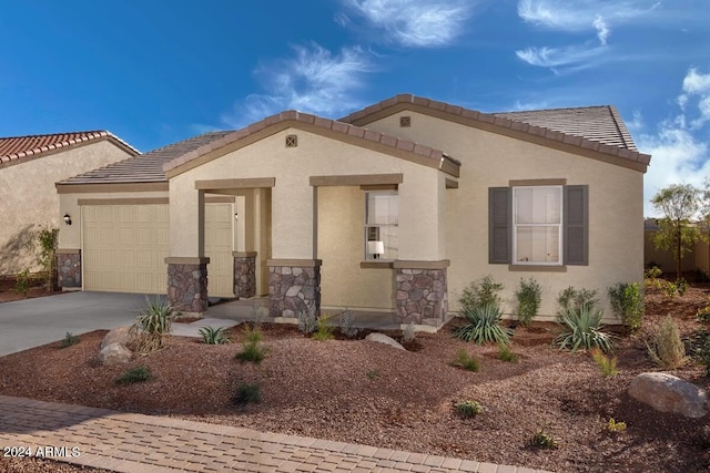 mediterranean / spanish-style home with a garage