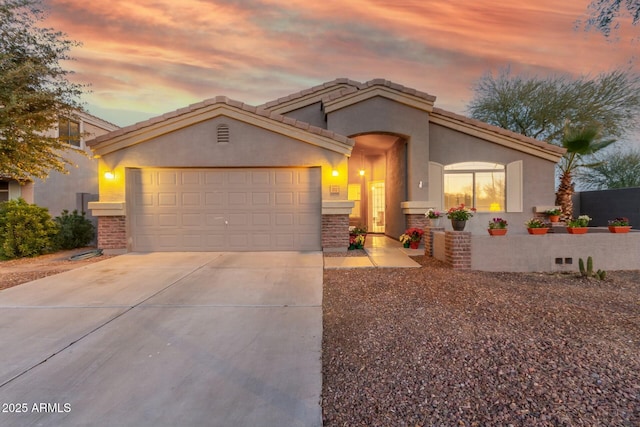 view of front of property with a garage