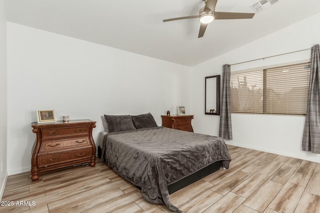 bedroom with ceiling fan and vaulted ceiling