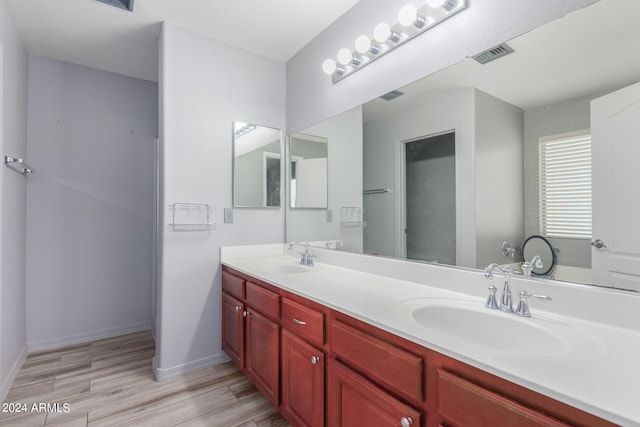 bathroom featuring vanity and hardwood / wood-style flooring