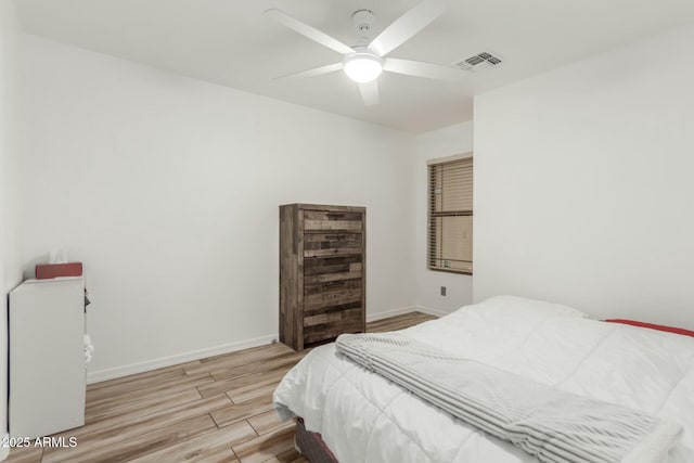 bedroom with ceiling fan and light hardwood / wood-style floors