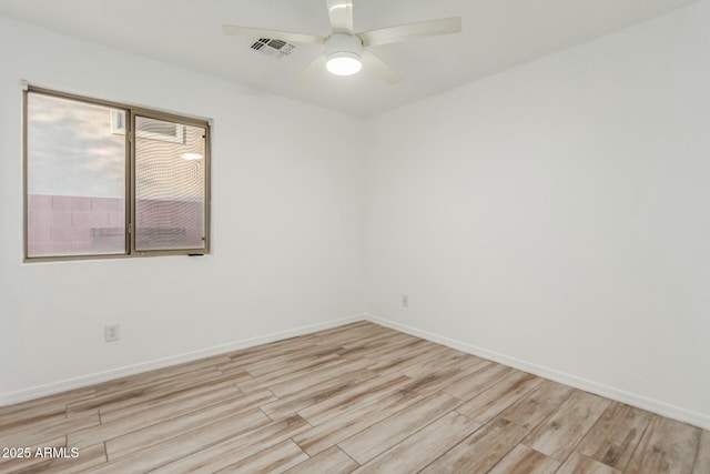 spare room with ceiling fan and light hardwood / wood-style floors