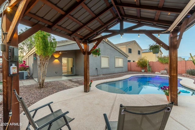 view of pool featuring a gazebo, a patio area, ceiling fan, and central air condition unit