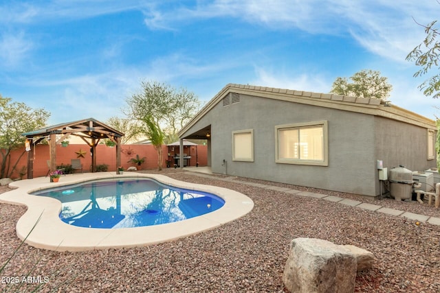 view of pool with a gazebo, a patio area, and grilling area