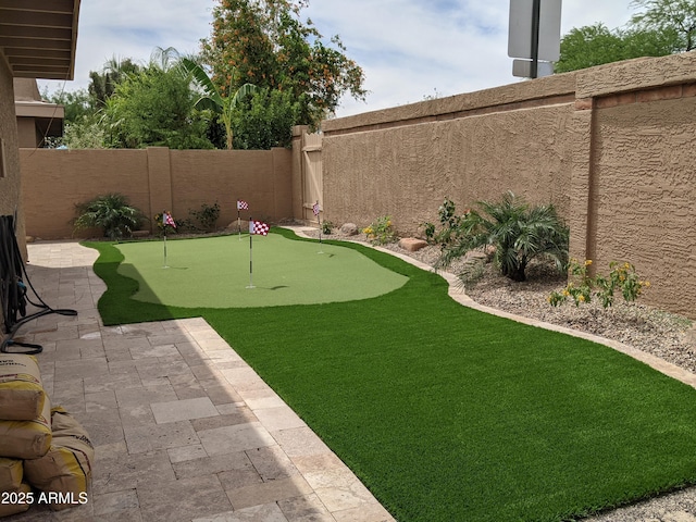 view of yard with a fenced backyard and a patio