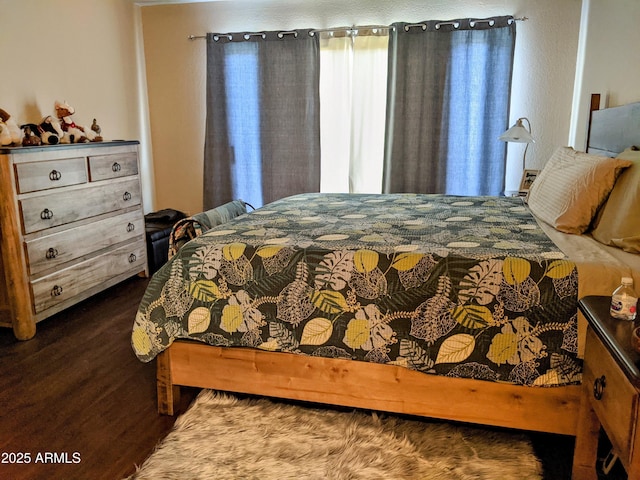 bedroom featuring wood finished floors