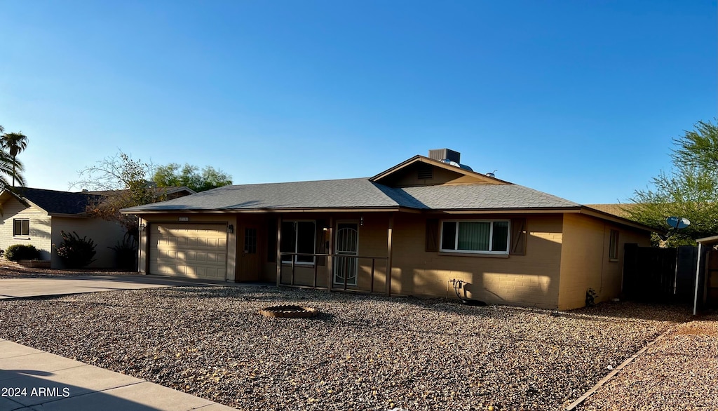 ranch-style home featuring a garage