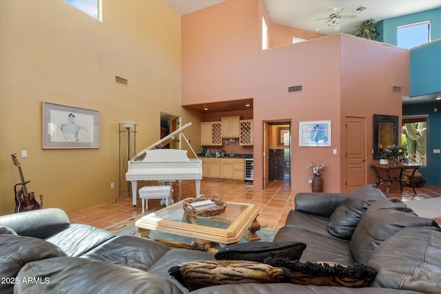25483 N Wrangler Rd, Scottsdale, AZ 85255 - living area with wine cooler, high vaulted ceiling, ceiling fan, and light tile patterned flooring