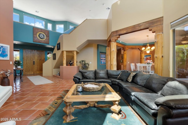 25483 N Wrangler Rd, Scottsdale, AZ 85255 - tiled living area featuring a chandelier, a high ceiling, and healthy amount of natural light